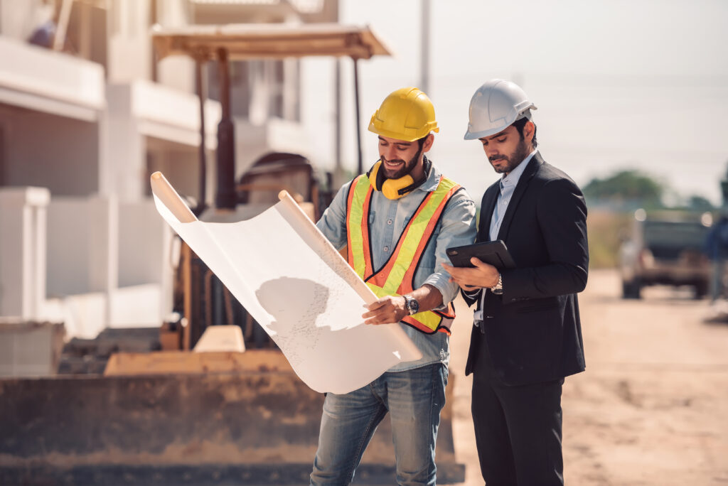 civil engineer construction worker manager holding digital tablet blueprints talking planing about construction site cooperation teamwork concept civil engineer construction worker manager holding digital tablet blueprints talking planing about construction site cooperation teamwork concept